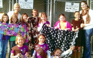 Front row, from left, are Dry Strickland, Maddie Stienberg and Gracie Turner. Back row: Clary Pederson, Julia Goff, Olivia deTriville, Collins Strickland, Nealie Nix, Samantha Phillips and Brittan Thomas. Troop leaders are Ericka Adams, left, and Anna Snipes, right. Not pictured: Lainey Davis.